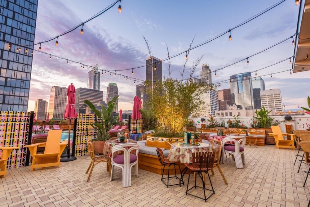 Rooftop lounge at Freehand Los Angeles with skyline views and outdoor seating
