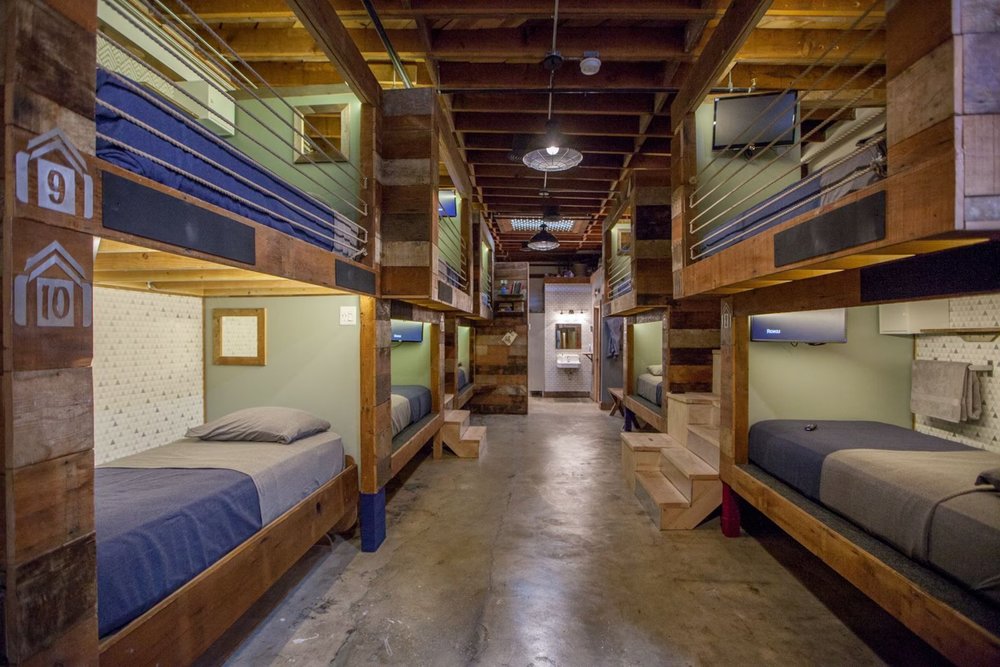 PodShare Los Angeles dorm room with modern bunk beds and shared space.