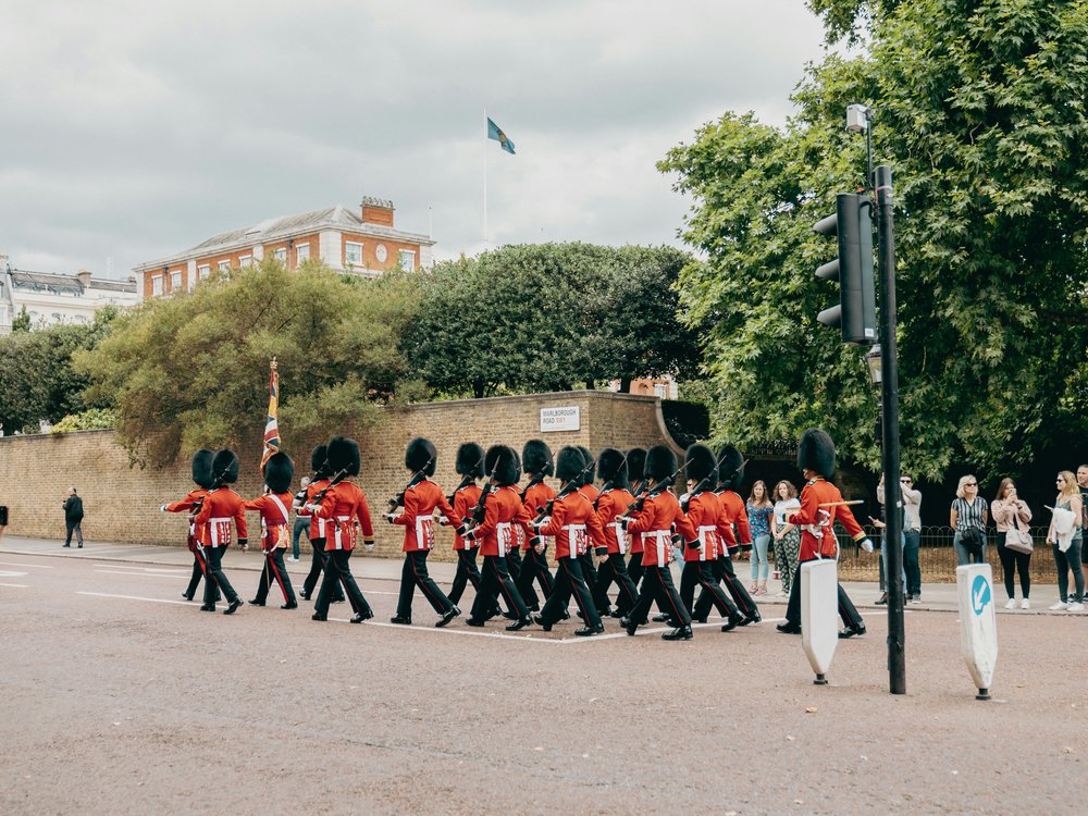 Changing of the guard in Buckingham Palace | Photo Credit: Micah Kunkle on Unsplash