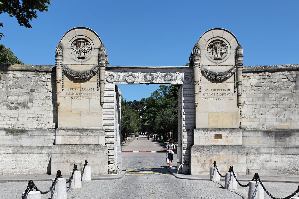 Stone entrance gate of Père Lachaise Cemetery in Paris