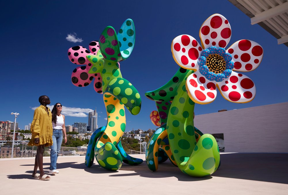 Sydney art galleries - Visitors admiring vibrant contemporary art sculptures at the Museum of Contemporary Art Sydney