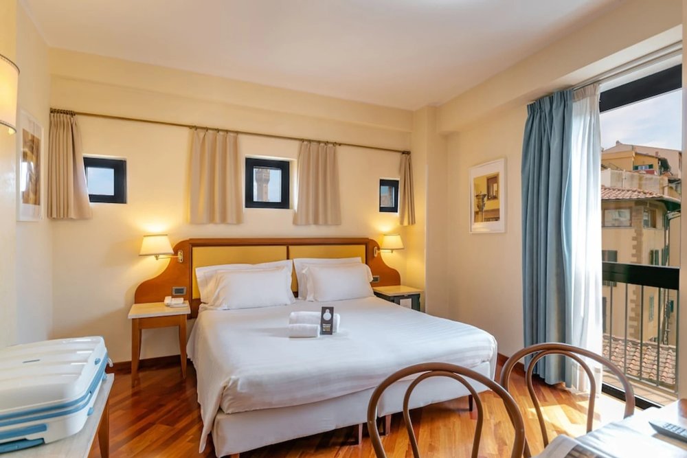 Comfortable hotel room with city view in Florence, Italy