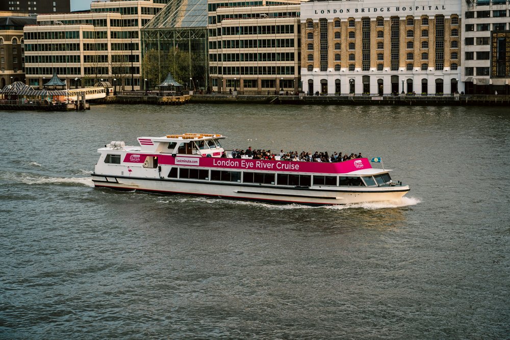 London Eye River Cruise boat sailing on the River Thames | Photo Credit: Eduard Pretsi on Unsplash