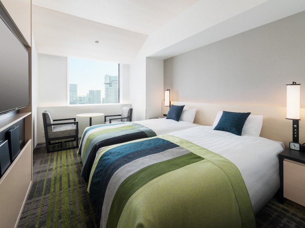 Clean and modern hotel room in Osaka with easy access to public transport