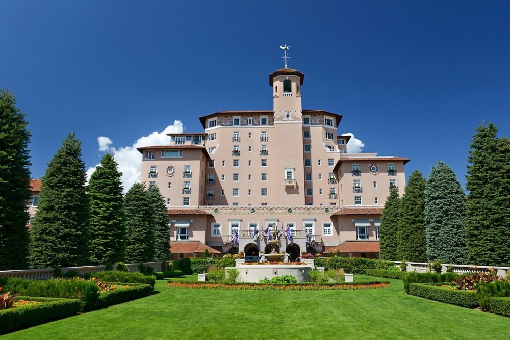 The Broadmoor luxury resort in Colorado Springs with historic building and landscaped lawns
