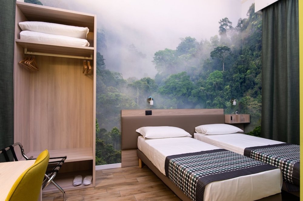 Twin hotel room in Milan designed for practical and affordable stays