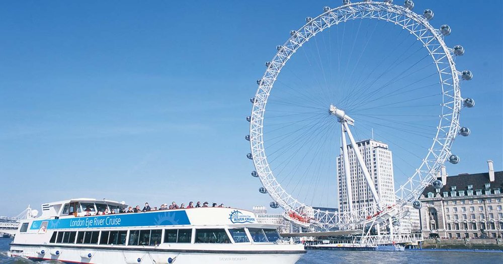 The London Eye, a giant observation wheel, stands along the River Thames