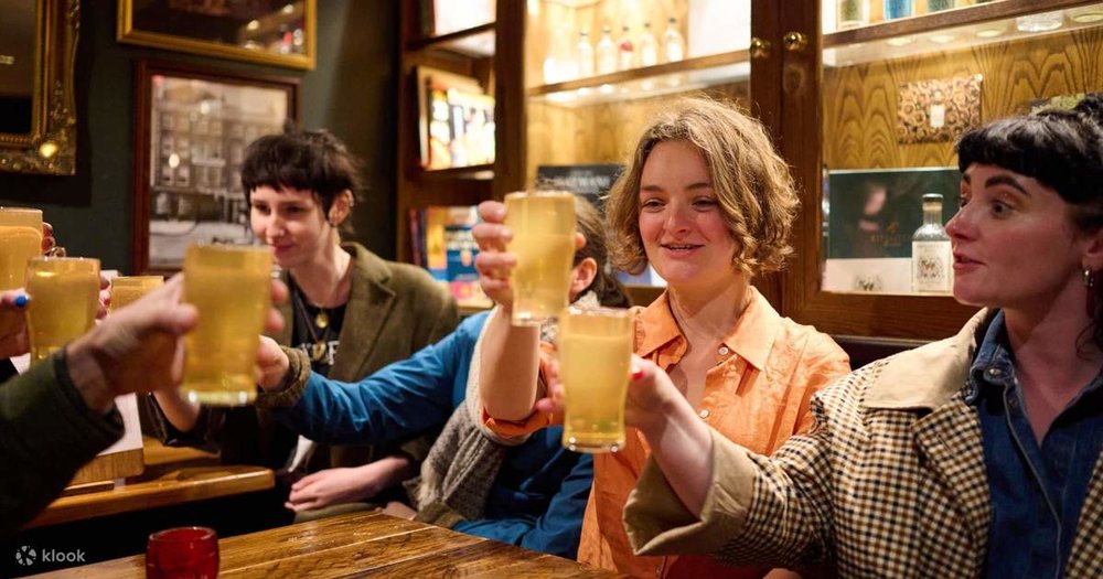 People socializing and drinking in a traditional London pub