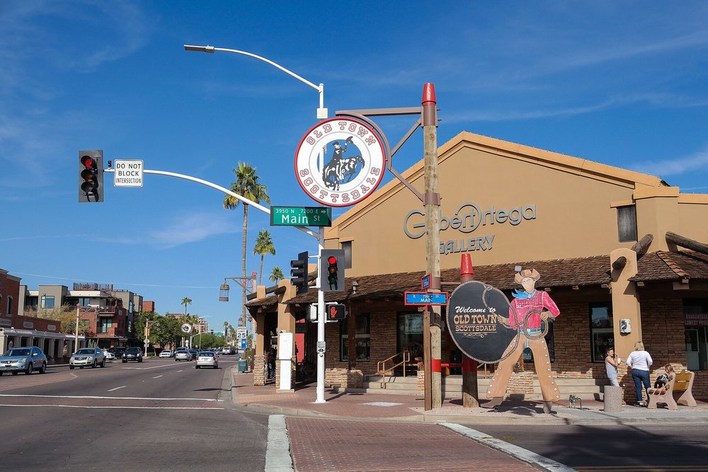 Old Town Scottsdale street scene with shops, signs, and clear blue skies