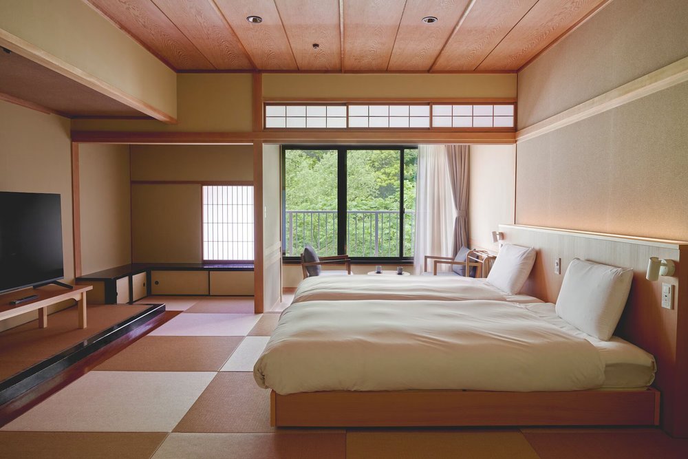 Traditional tatami room with river view at Hakone Pax Yoshino ryokan