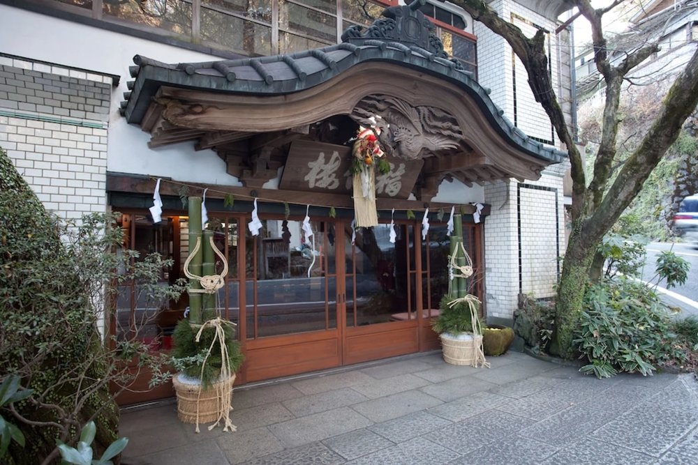 Exterior of Fukuzumiro, a historic wooden ryokan in Hakone Yumoto