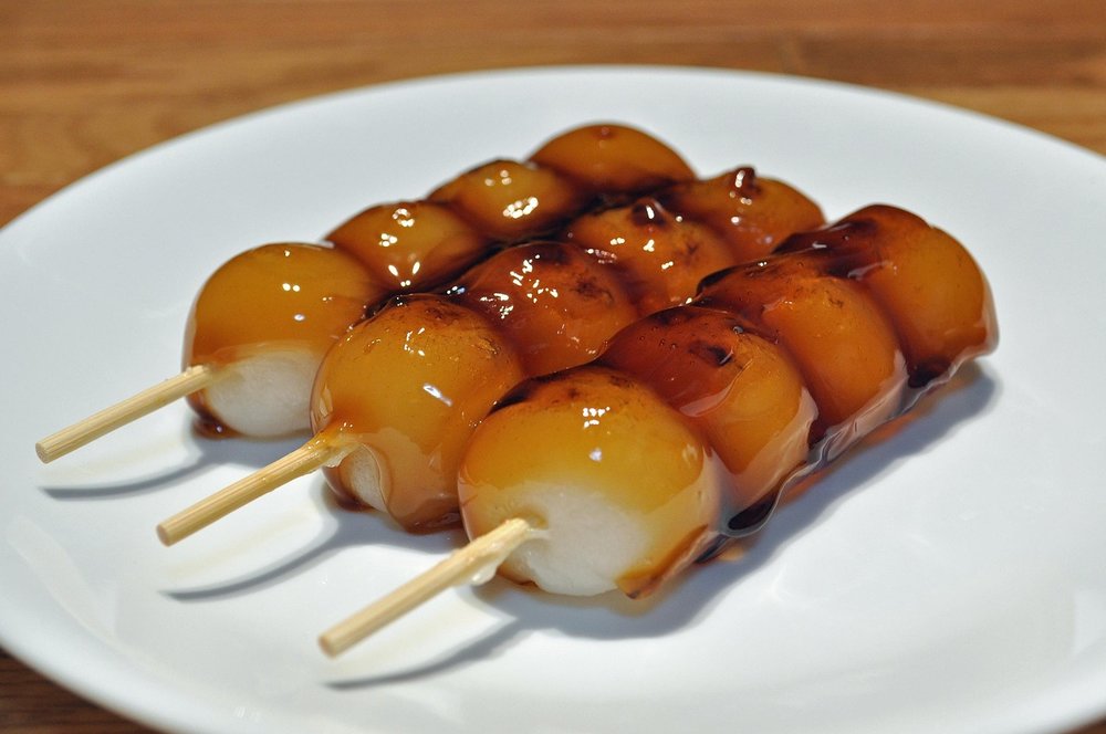 Mitarashi dango served on skewers.