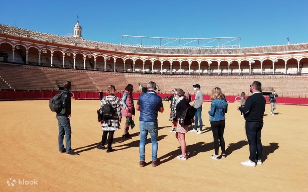 Group gathered on a guided ghost tour at night in Seville’s old town.