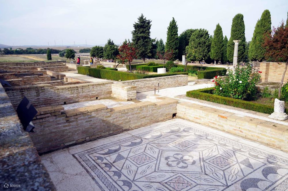 Roman mosaic floor and stone ruins at the archaeological site of Itálica in Santiponce near Seville.
