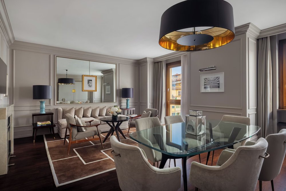 Elegant living space at Portrait Firenze with modern design and city views