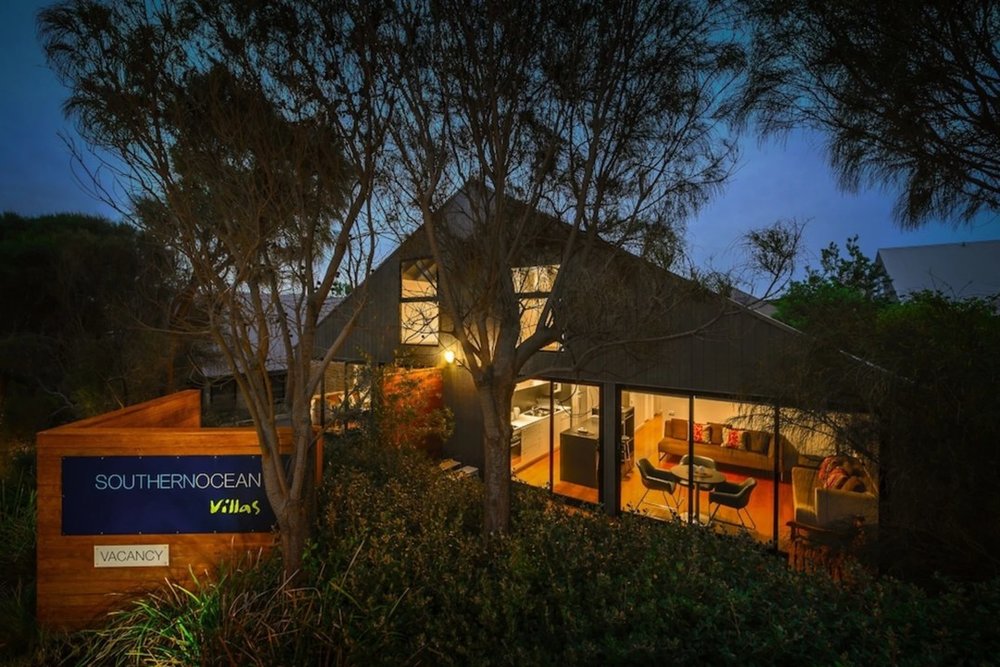 Minimalist villa with warm lights at night