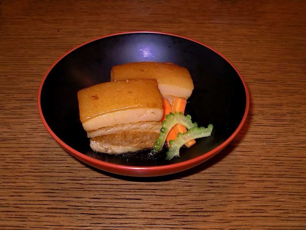 Traditional Okinawan rafute pork belly braised until tender and served with vegetables