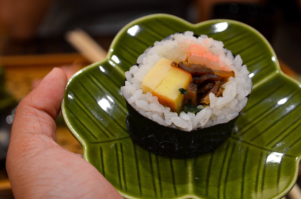 Okinawan goya champuru with bitter melon, tofu, egg, and pork on a plate