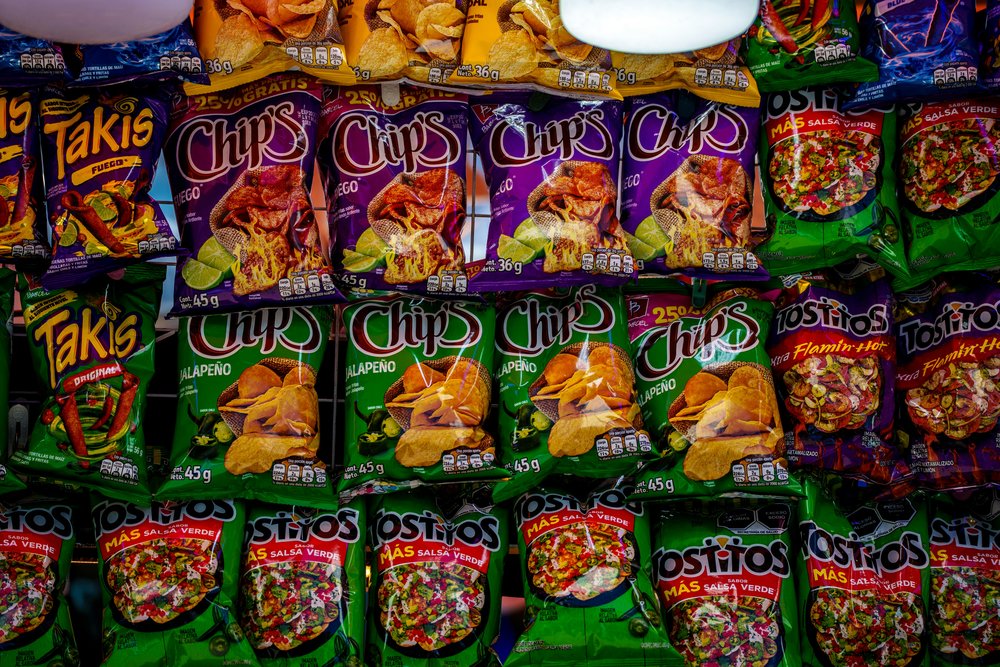 Variety of potato crisps on a store shelf in the United Kingdom
