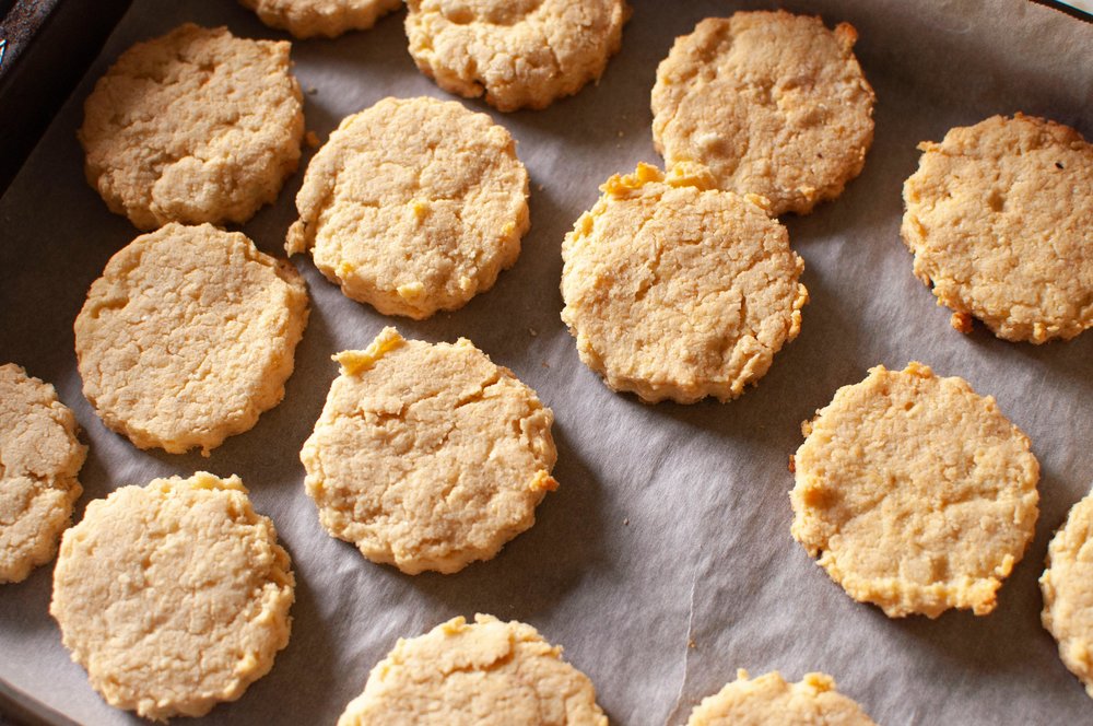 Homemade British biscuits arranged on a baking sheet