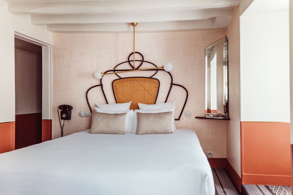 Stylish bedroom at Hotel Panache with warm tones, modern design, and boutique hotel charm