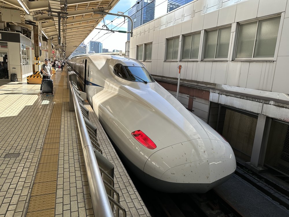 Shinkansen bullet train parked at a train station in Japan