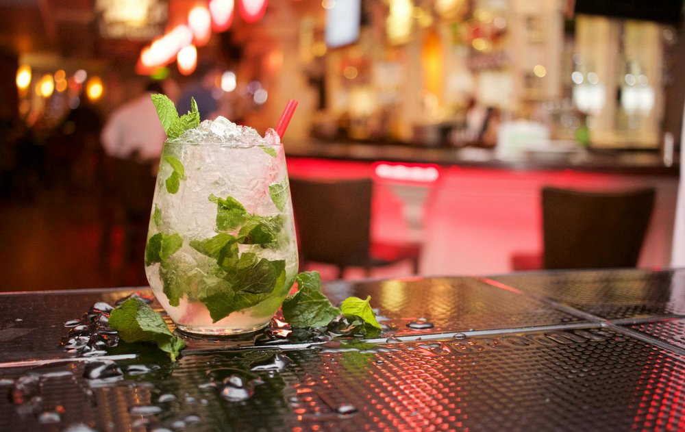 Close-up of a mojito cocktail on a bar counter in Ho Chi Minh City