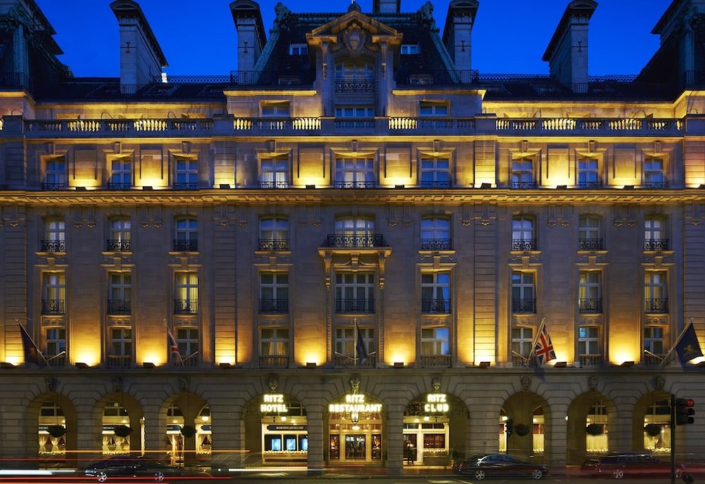 The Ritz London exterior illuminated at night in central London