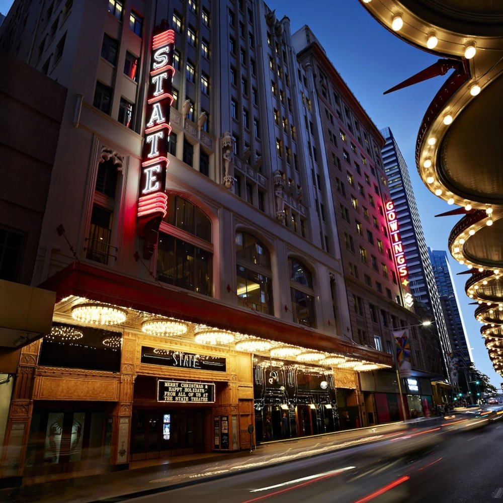  QT Sydney and State Theatre Sydney illuminated at night with classic signage