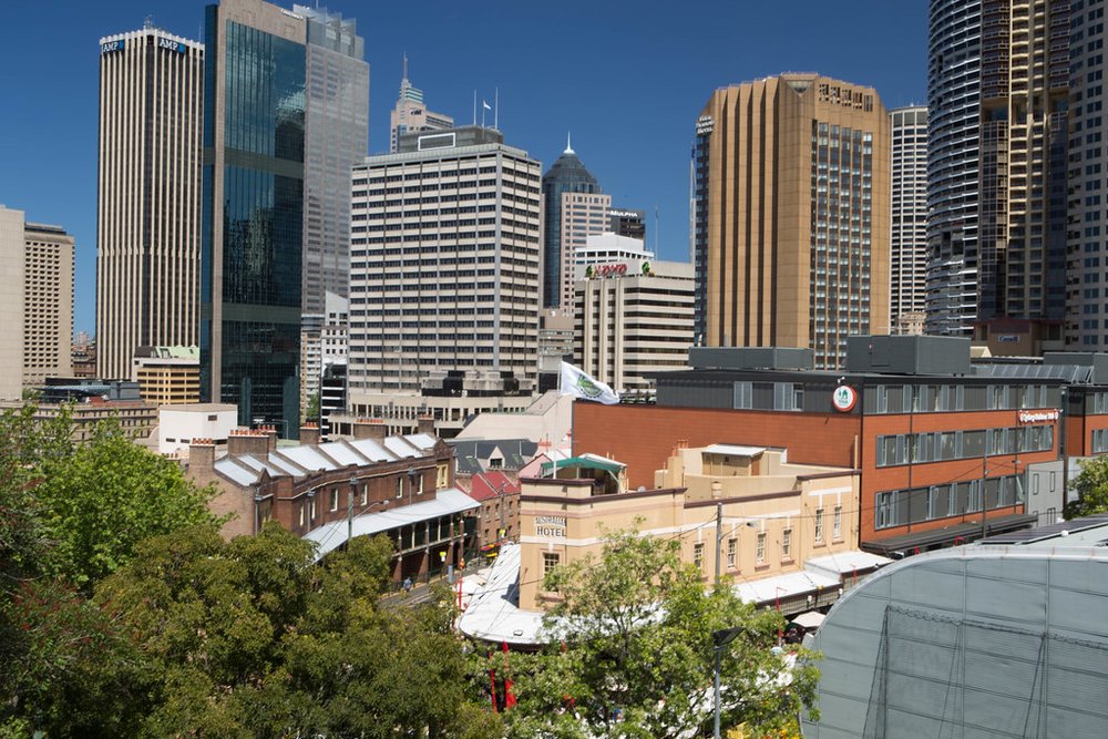  The Rocks neighborhood with Sydney Harbour Bridge in the background