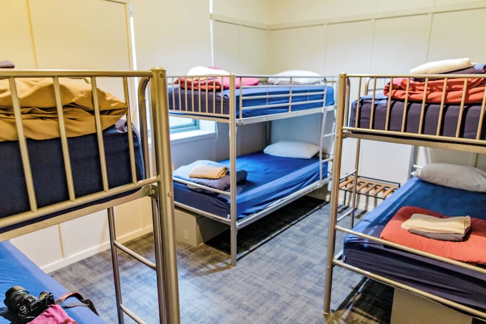 Comfy bunk beds in a spacious and stylish dorm room at Absoloot Hostel, Queenstown