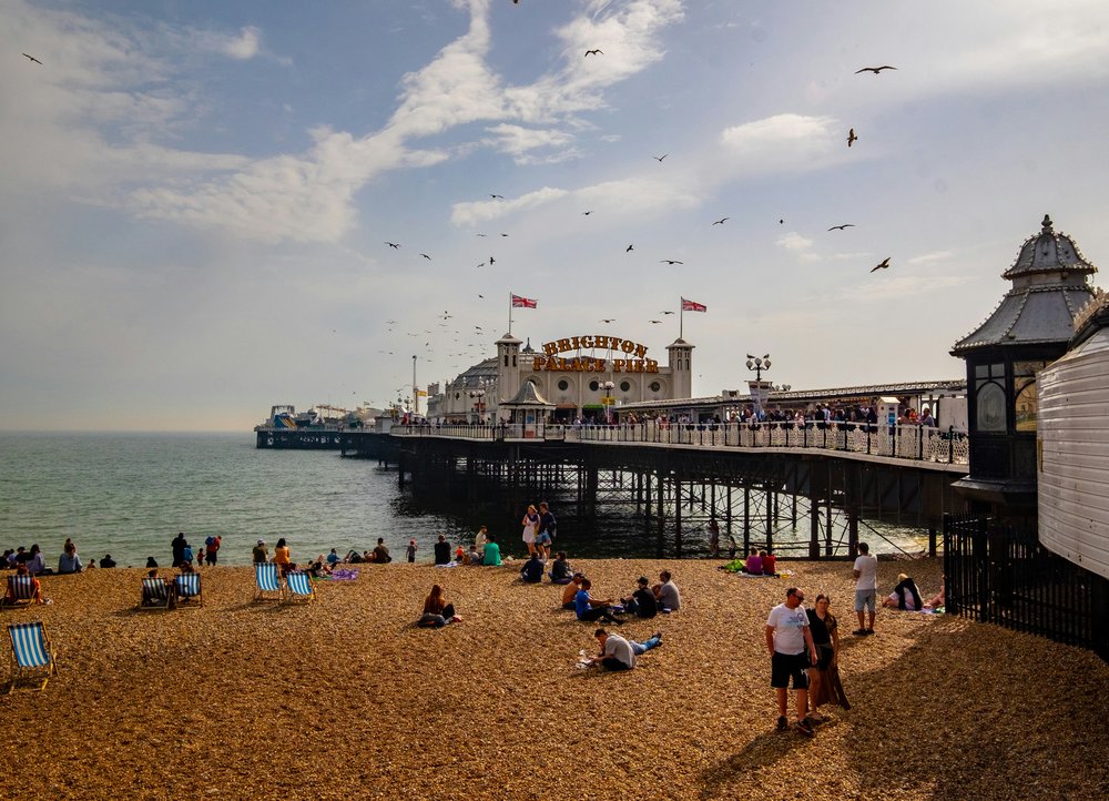  Brighton Beach and Palace Pier on sunny day | Photo Credit: Ben Guerin on Unsplash
