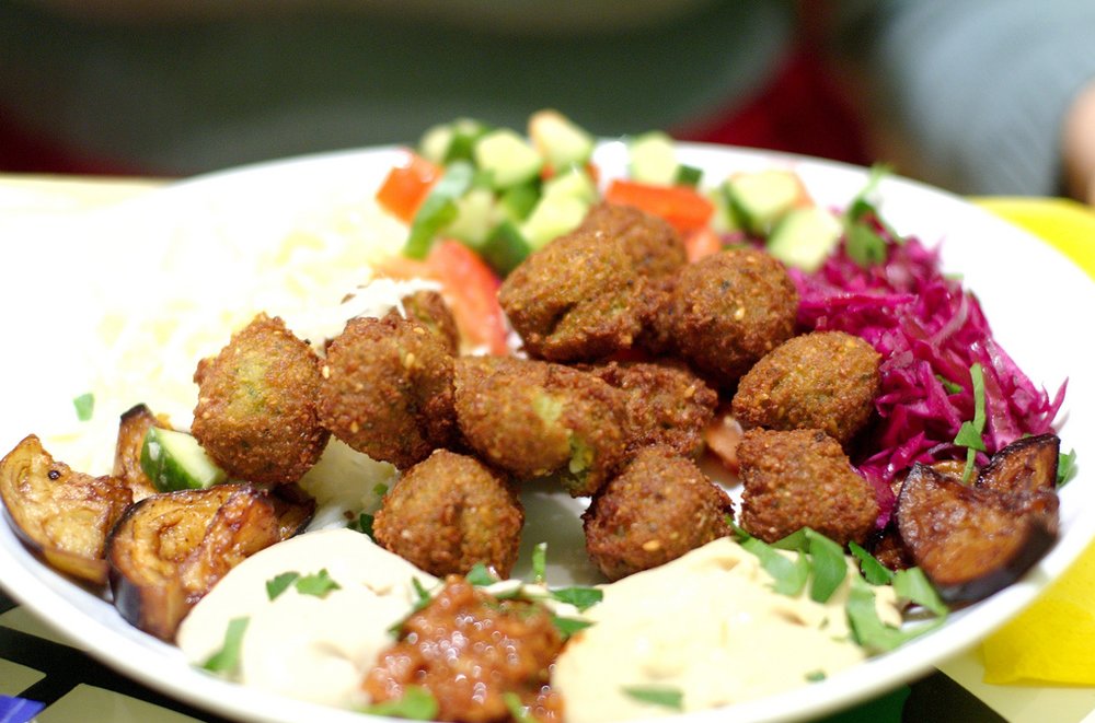 Falafel plate with vegetables and sauces