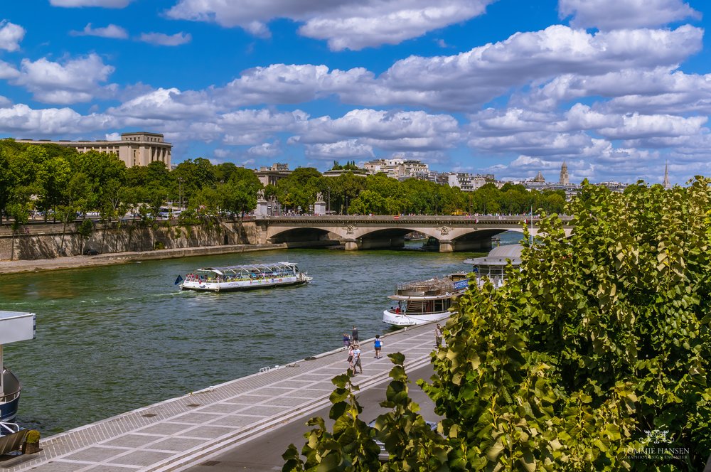 Seine River view with boats and riverside walk