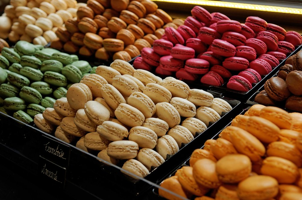 Colorful French macarons display in bakery