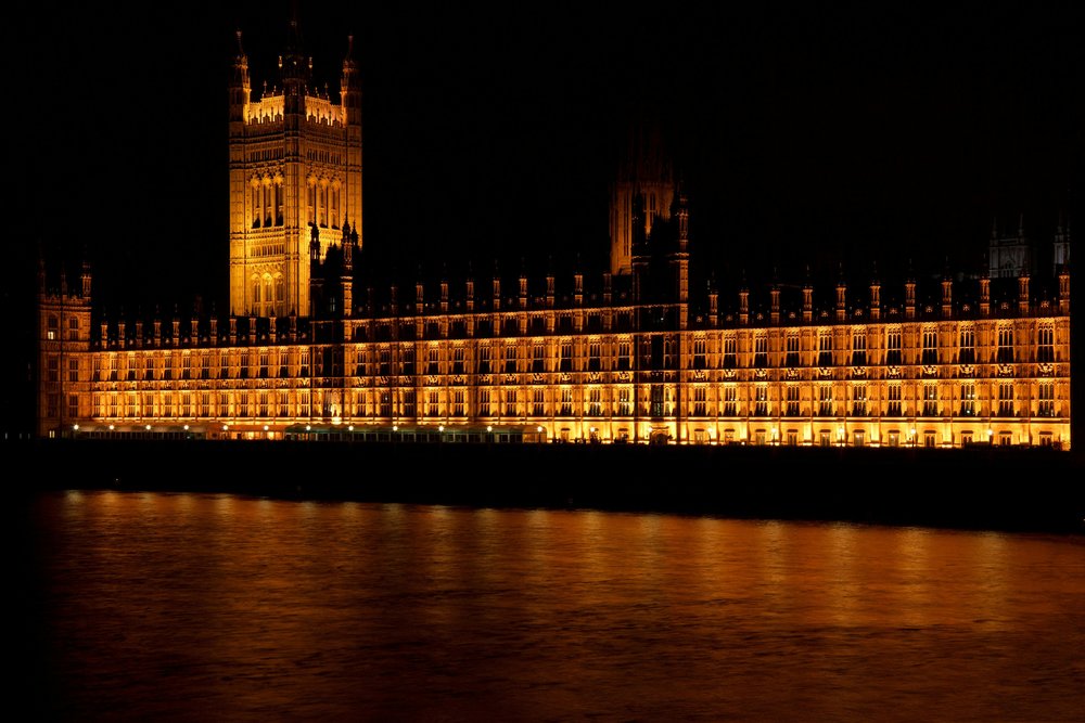 Houses of Parliament glowing gold at night in London