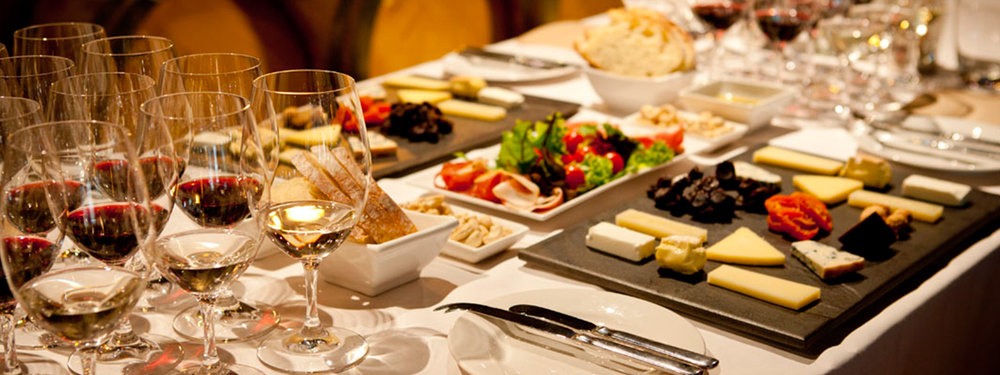 Selection of Australian wines with cheese and gourmet platters on table