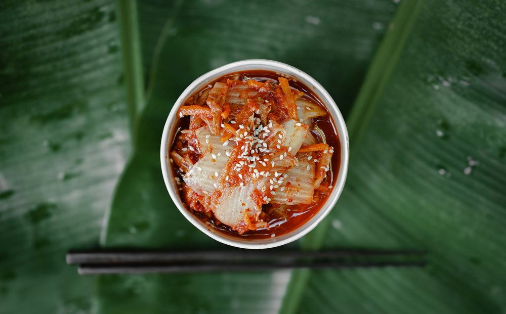 A close-up of kimchi garnished with sesame seeds | Photo Credit: Frames For Your Heart on Unsplash