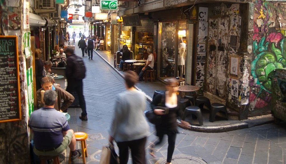 People walking through lively alleyways