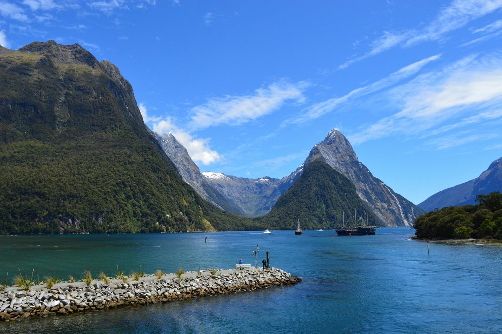 Sound fjord with towering mountains and clear blue water in New Zealand