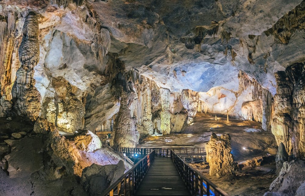 Interior of Phong Nha Cave with stalactites and wooden walkway