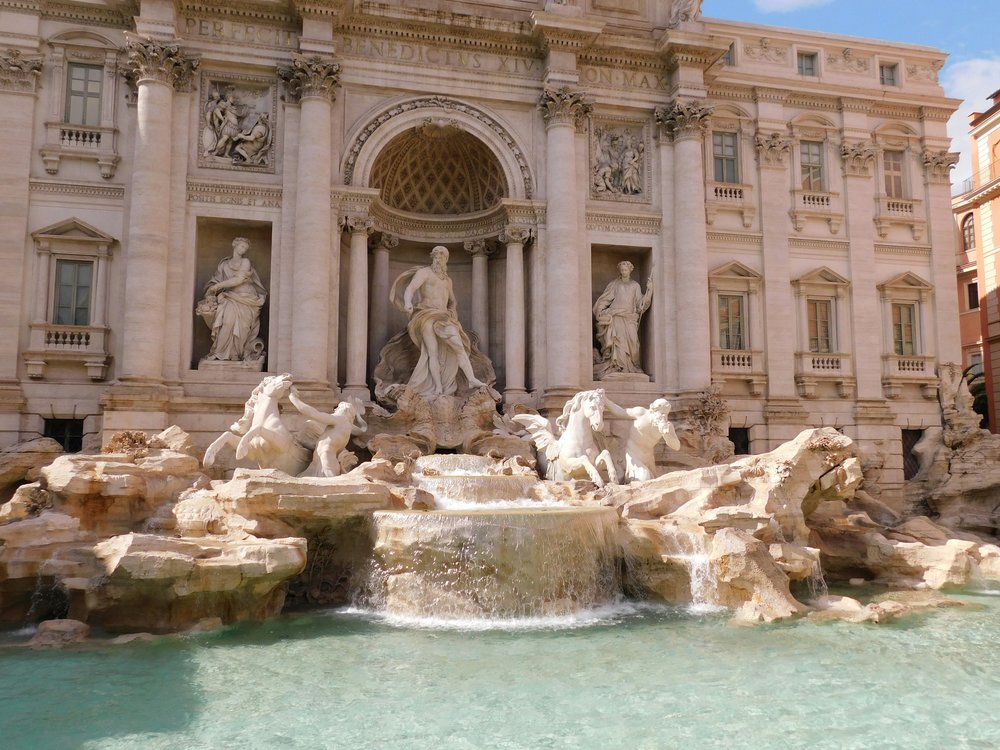 Trevi Fountain in Rome with detailed Baroque statues and turquoise water | Photo Credit: Viviana Couto Sayalero on Unsplash