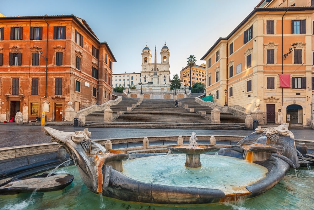 Spanish Steps in Rome leading up to Trinità dei Monti church at sunrise