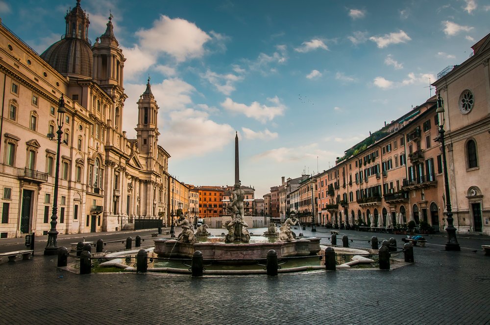 Piazza Navona in Rome with Fountain of the Four Rivers and historic buildings | Photo Credit: Fernando Mola-Davis on Unsplash