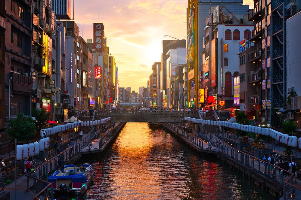 The sunset showing through the buildings along Dotonbori