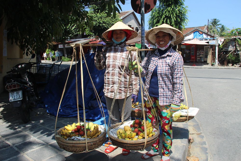 Local vendors selling fresh fruit at Hoi An Central Market | Photo Credit: Flickr
