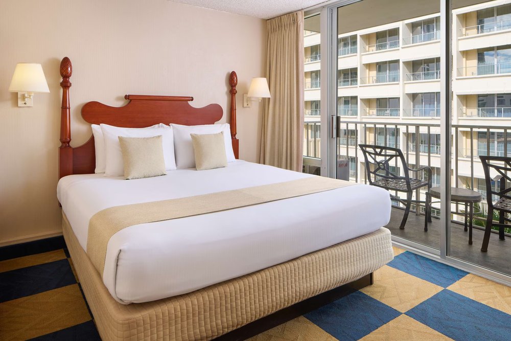 Ewa Hotel Waikiki room with king bed and private balcony in Waikiki