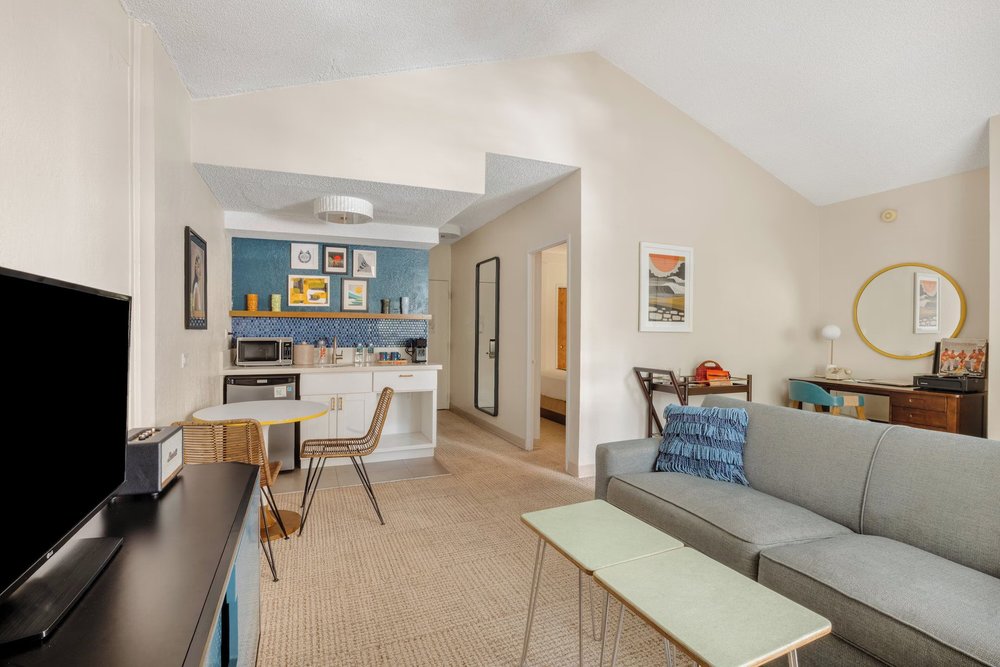 Retro-style suite at White Sands Hotel with sofa and kitchenette