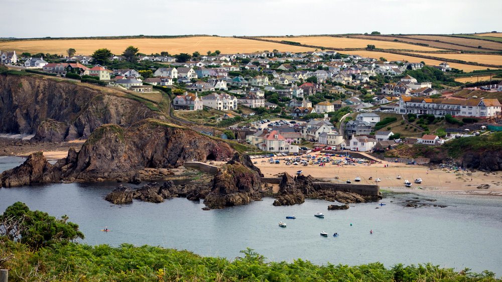A coastal village in the UK with beautiful beaches and surrounding nature