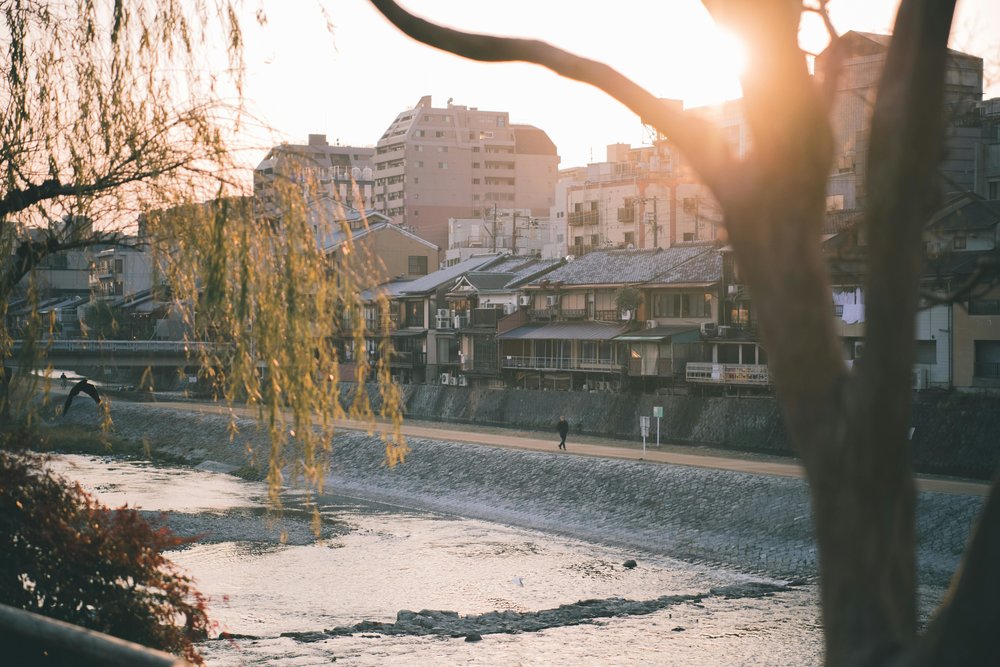 The sun rising over Kamo River and other houses